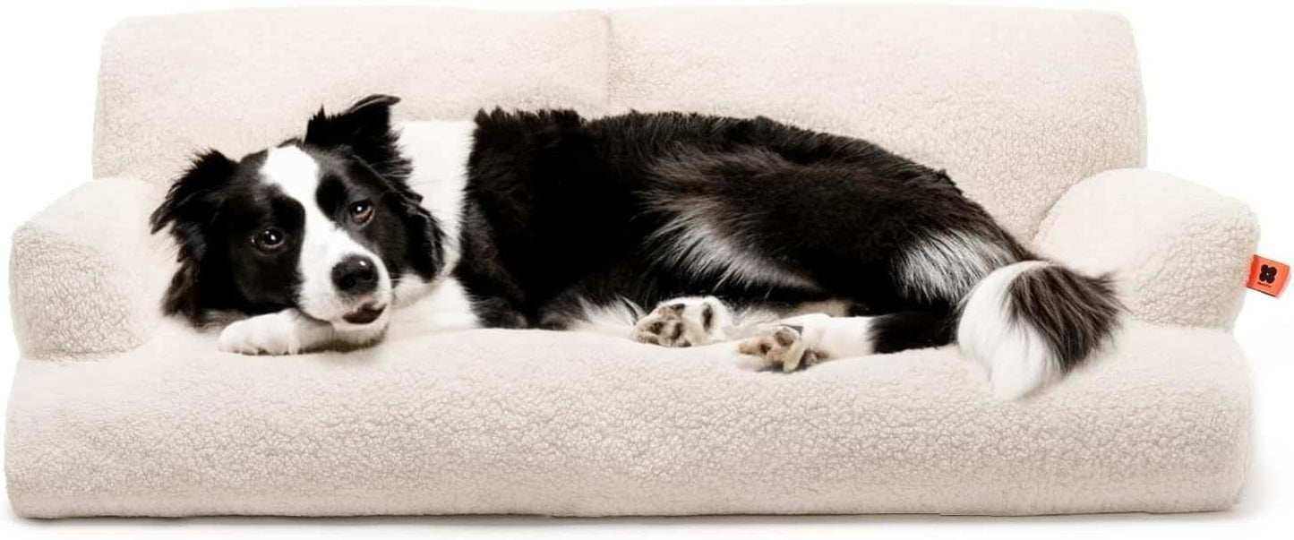 Black and white dog lying comfortably on a cream-colored Waterproof Pet Bed from Printify