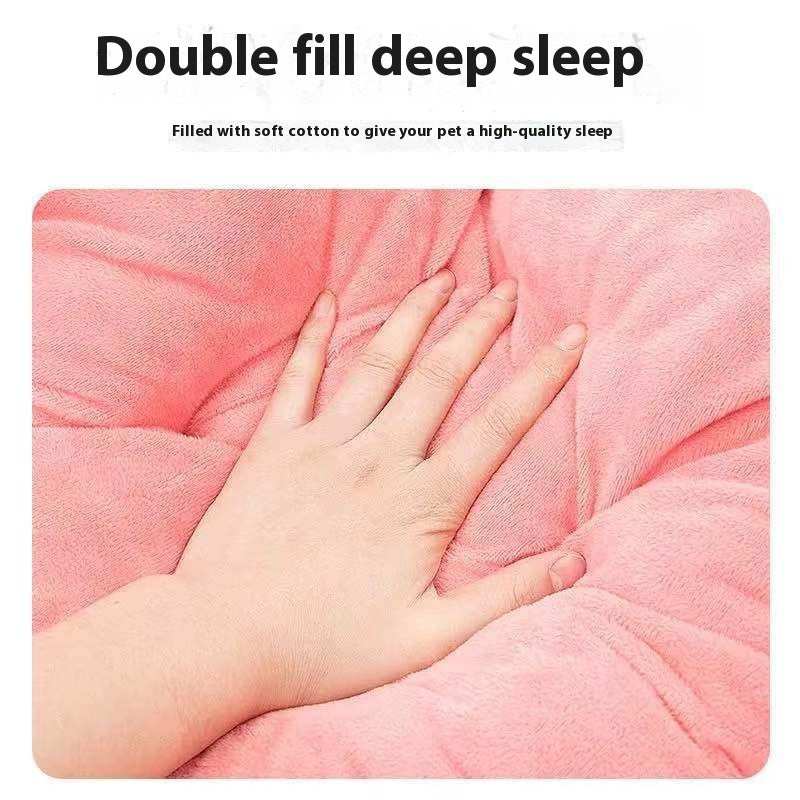 Pink pet bed with a hand for scale, labeled 'Double fill deep sleep'.