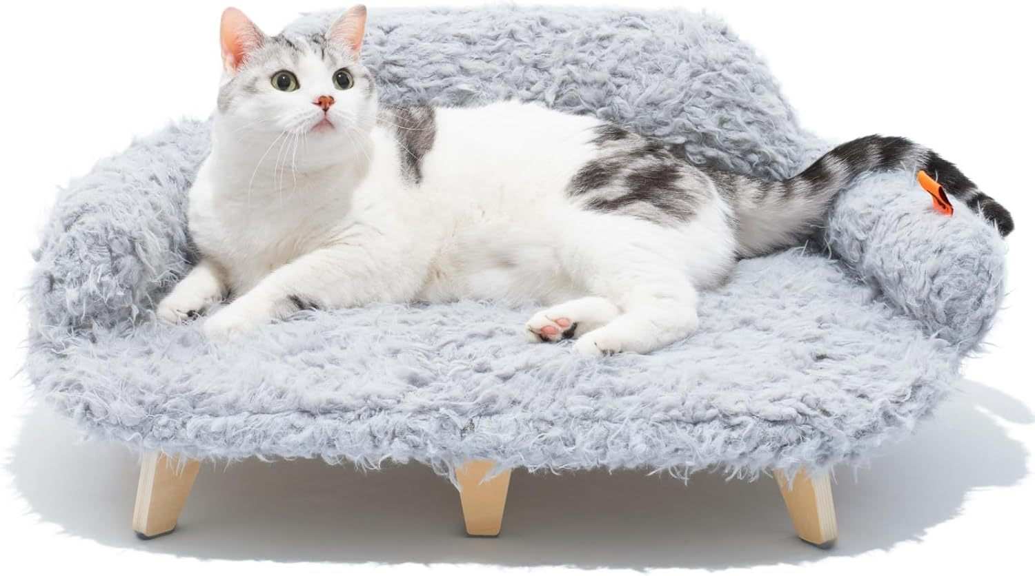 Cat lying on a fluffy gray pet bed with wooden legs against a white background