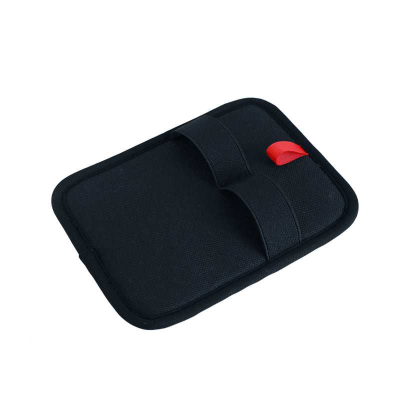 Black mouse pad with a red button on a white background