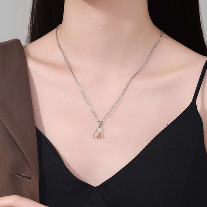 Necklace with a heart-shaped pendant worn by a model