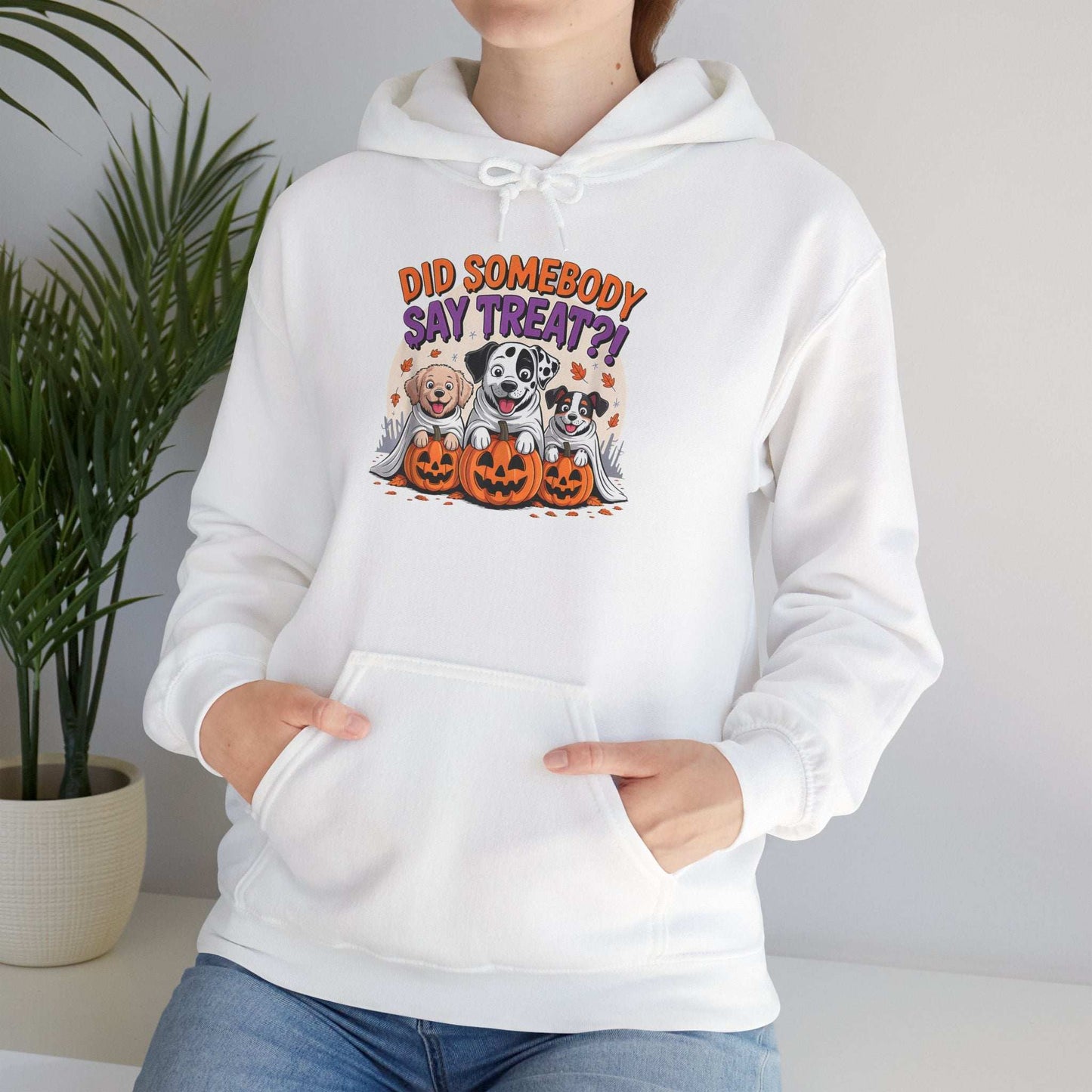 Printify white hoodie featuring Halloween Dog Sweatshirt design of three dogs with pumpkins and fall leaves