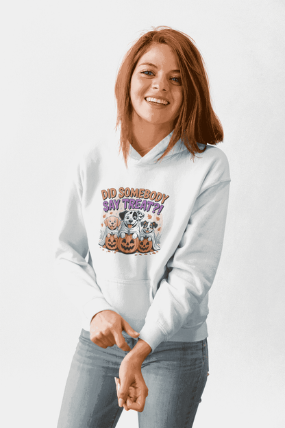 Printify white hoodie featuring Halloween Dog Sweatshirt graphic with three dogs in jack o lanterns and treat text