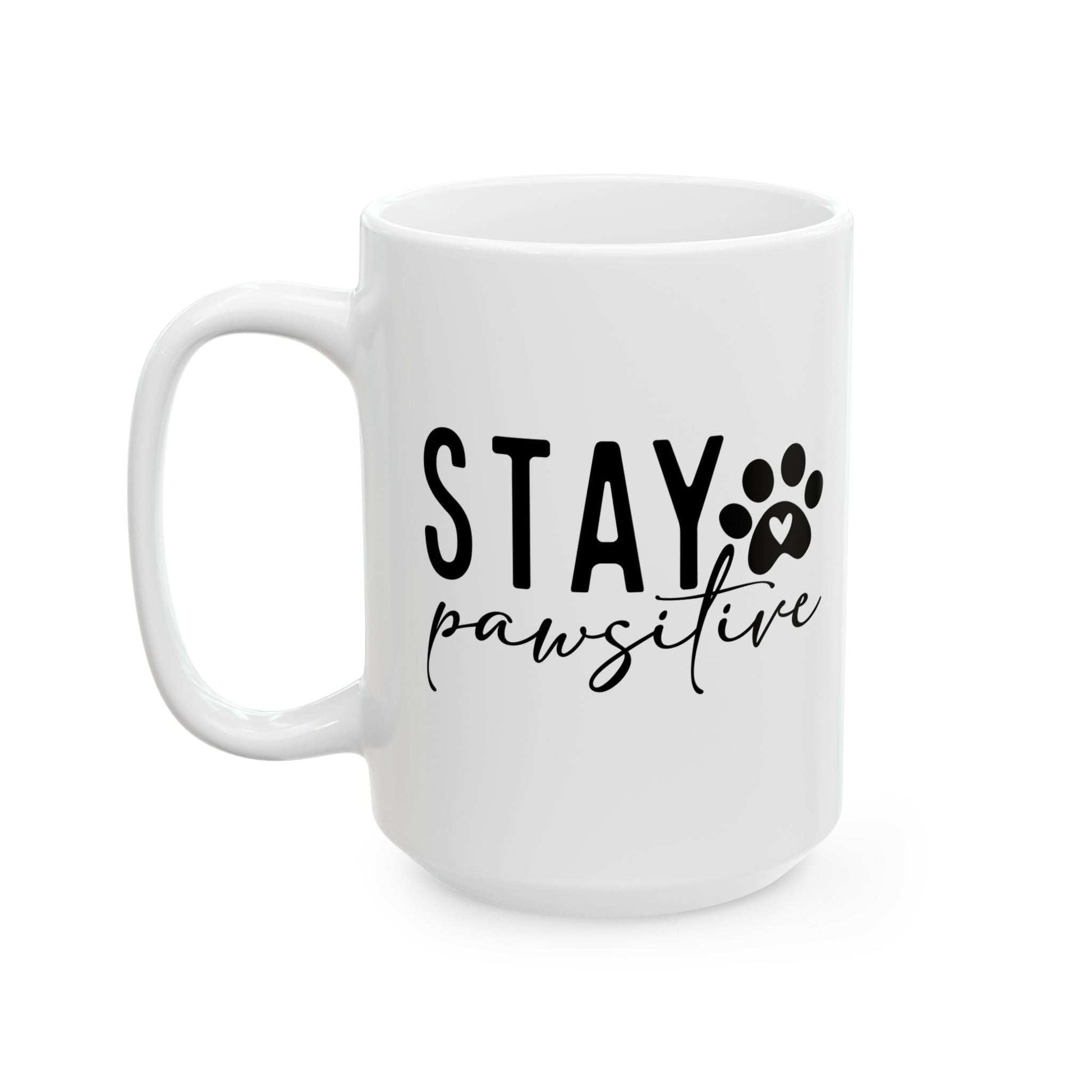 White ceramic Stay Pawsitive Mug with black paw print and text design by Printify