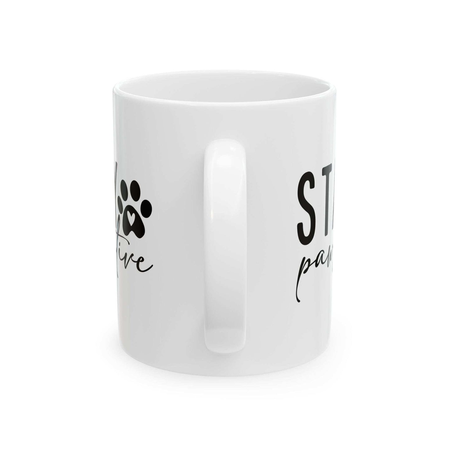 White ceramic Stay Pawsitive Mug with black paw print design and positive message from Printify
