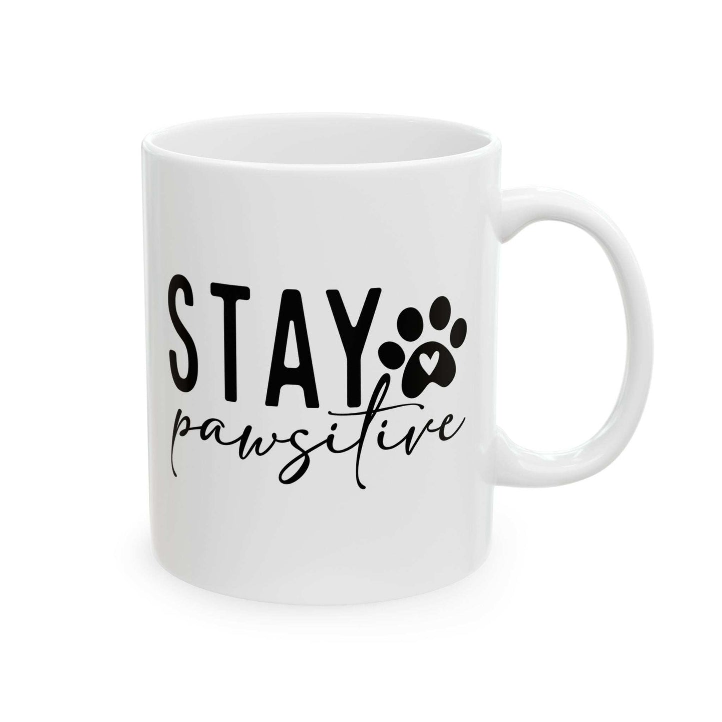White ceramic Stay Pawsitive Mug with black text and paw print design
